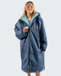 Girl pulling zip up on Limited Edition RNLI dryrobe Advance