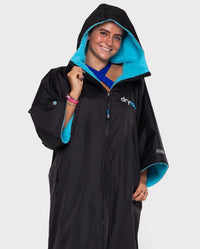 Woman wearing Black Blue dryrobe® Advance Short Sleeve with hood up