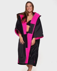 Woman wearing Black Pink dryrobe® Advance Short Sleeve unzipped