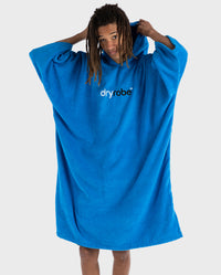Man putting hood up on Cobalt Blue Organic Towel dryrobe®