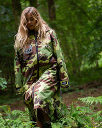 Woman walking through woods wearing Red Bull Hardline dryrobe® Advance Long Sleeve