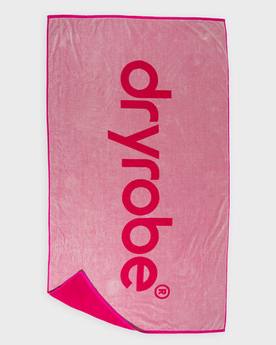Flat studio shot of reverse of pink Dryrobe® beach towel  