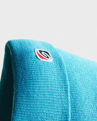 Close up of wave symbol on Blue dryrobe® Eco beanie 