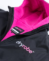 Close up of hood and logo on Black Pink dryrobe® Advance Short Sleeve unzipped