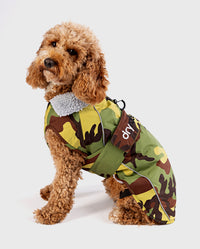 Cockapoo sitting facing the side, wearing Camo Grey dryrobe® Dog
