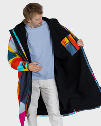 **MALE** Man wearing dryrobe Advance Abstract showing the fleece inner lining