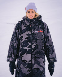 Lucy Campbell wearing Black Camo dryrobe® Advance Long Sleeve in the snow 