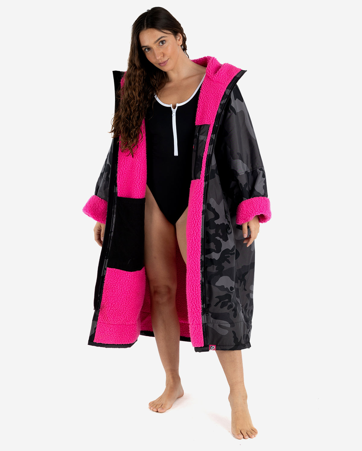 Woman wearing Black Camo Pink dryrobe® Advance Long Sleeve, unzipped