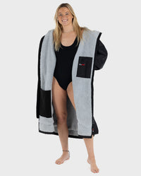 Woman wearing unzipped Black Grey dryrobe® Advance 