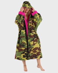 Woman wearing Camo Pink dryrobe® Advance Long Sleeve with the hood up 