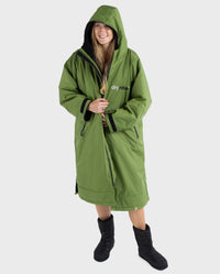 Woman wearing Forest Green dryrobe® Advance Long Sleeve and dryrobe® Thermal Boots 