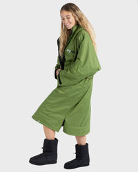 Woman wearing Forest Green dryrobe® Advance Long Sleeve and dryrobe® Thermal Boots