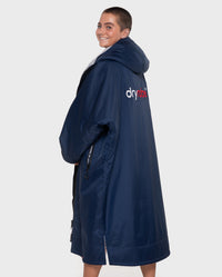 Woman wearing  Navy Grey dryrobe® Advance Long Sleeve with back to the camera
