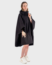 Girl wearing Black dryrobe® Kids Waterproof Poncho