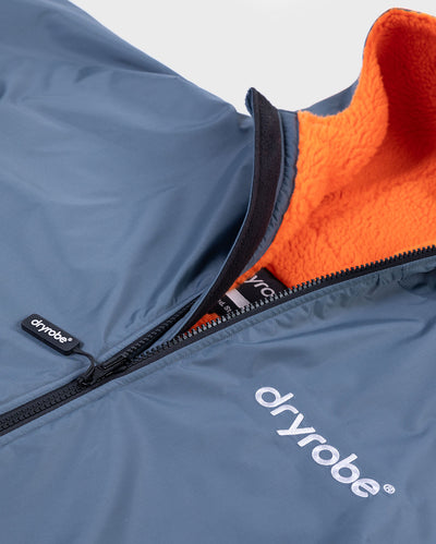Close up of logo on dryrobe Advance Long Sleeve Changing robe in Dark Grey Orange