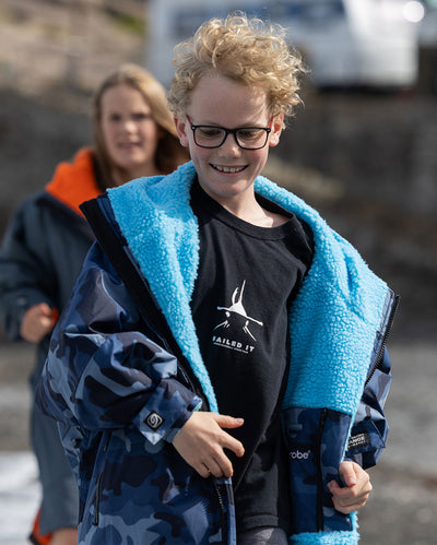 Kids running towards camera, wearing dryrobe Advance Long Sleeve Changing robes