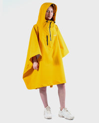 Girl wearing Yellow Kids dryrobe® Waterproof Poncho with hood up 