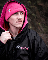 Close up of *MALE* wearing Pink dryrobe® Eco Beanie and Black Pink dryrobe® Advance Long Sleeve