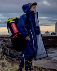 *MALE* carrying a bag over his shoulder, while wearing Navy Grey dryrobe® Advance Long Sleeve