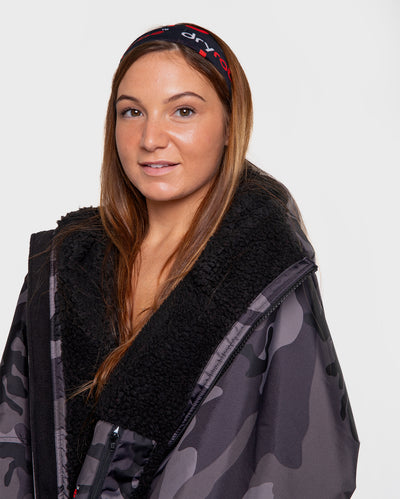 Woman wearing dryrobe® neck tube as headband