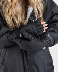 1|Woman wearing dryrobe® Eco Thermal Gloves, with one hand wearing it fingerless