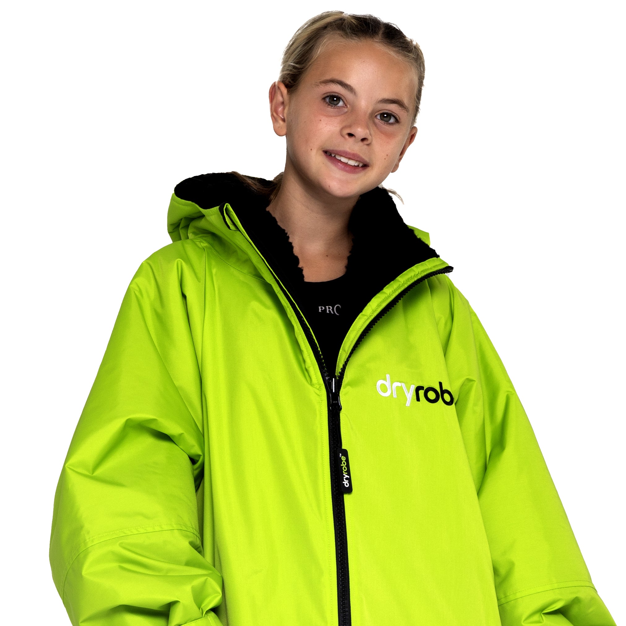 Girl wearing kids dryrobe® Advance change robe in lime green and black