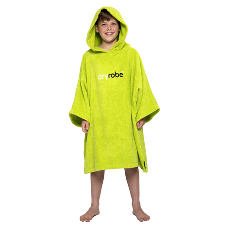 Boy wearing organic cotton towel dryrobe® in orangeBoy wearing organic cotton towel dryrobe® in lime green