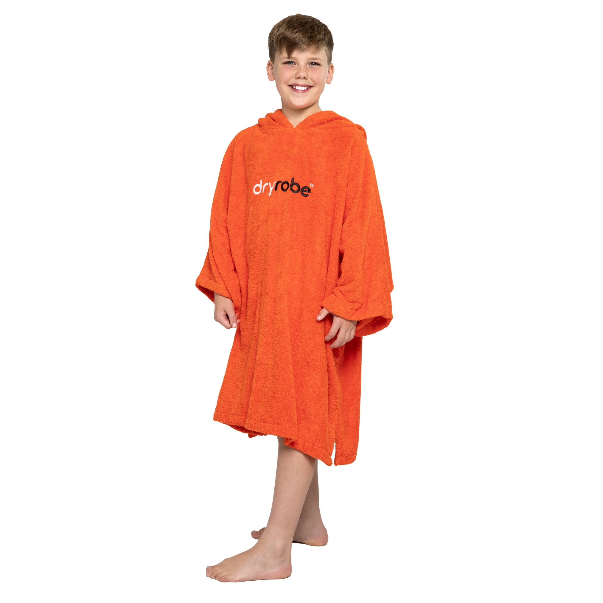 Boy wearing organic cotton towel dryrobe® in orange side view