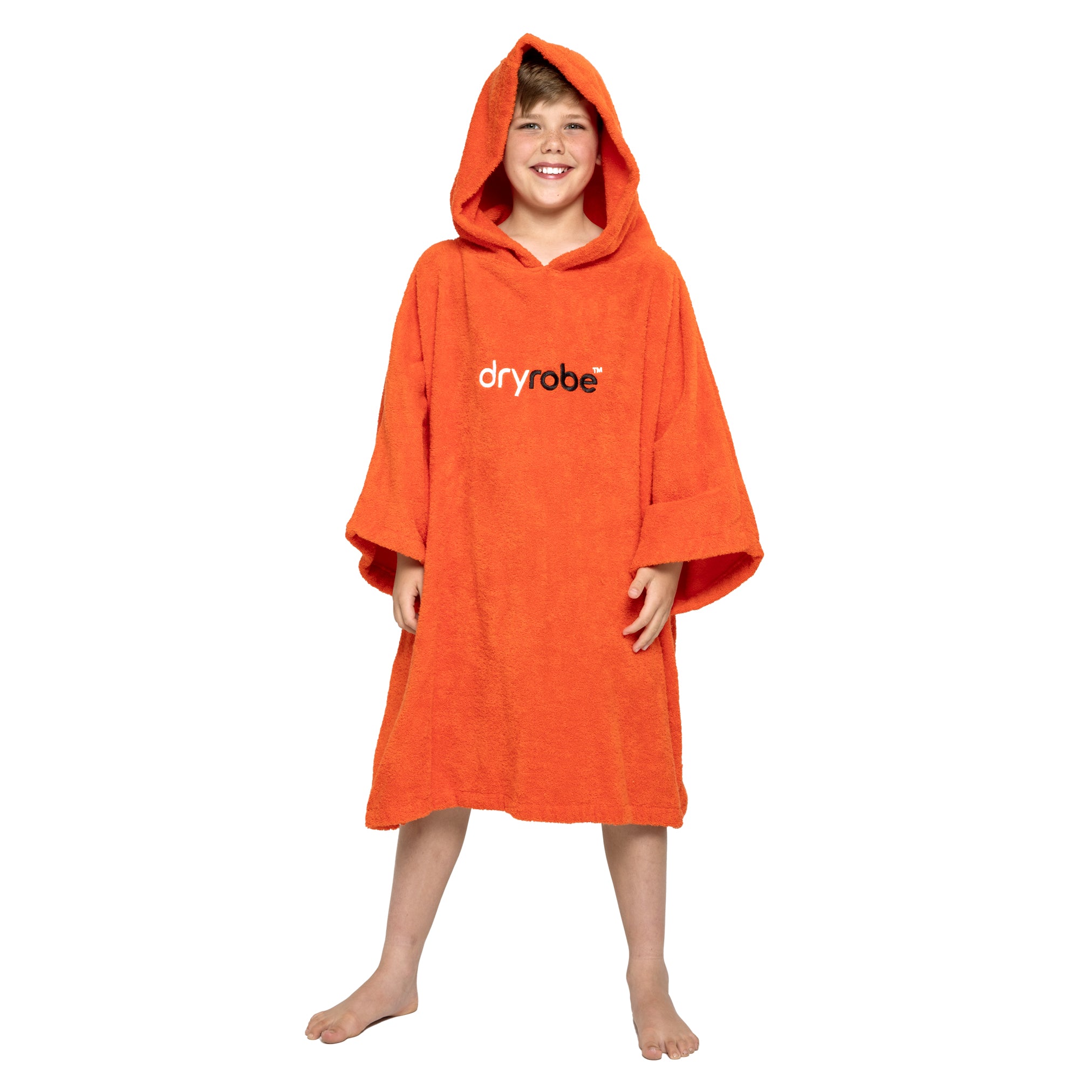 Boy wearing organic cotton towel dryrobe® in orange